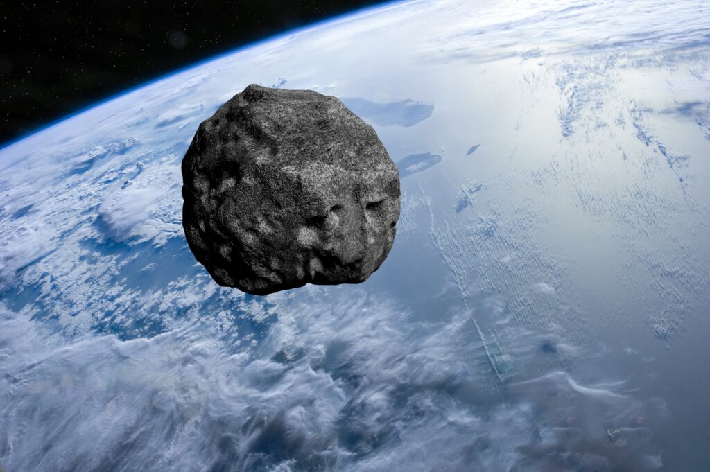 Darstellung des Asteroiden 2024 YR4 mit seiner möglichen Flugbahn zur Erde.